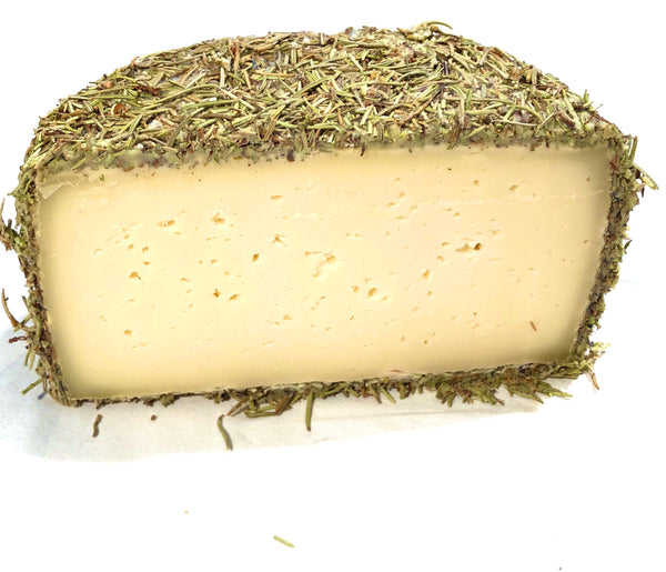 Medio queso de oveja curado con romero 1.200kg aprox